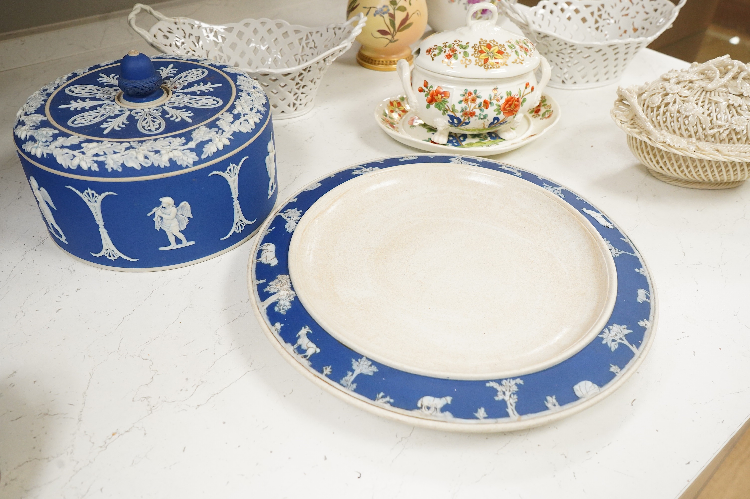 A 19th century Derby tureen and cover, a pair of Royal Worcester blush vase-26cm high, a Belleek basket and cover, a Wedgwood blue Jasperware cheese dish and associated cover, two continental baskets and vase. (7).
